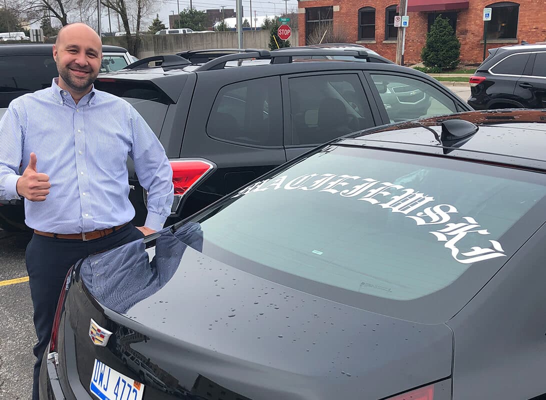 Andy Maciejewski with a decal of his name on his car for his birthday