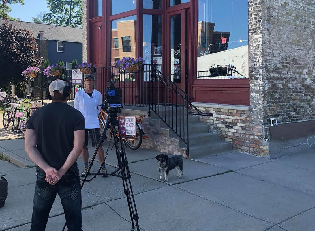 Jonathan Stepanski video taping Muskegon local and dog