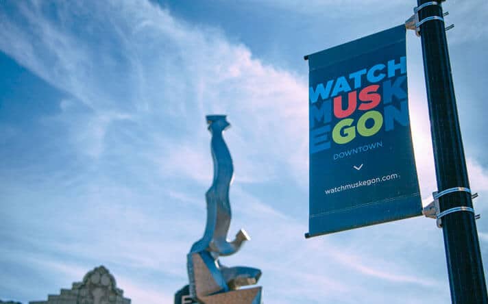 Watch Muskegon pole banner in Downtown Muskegon
