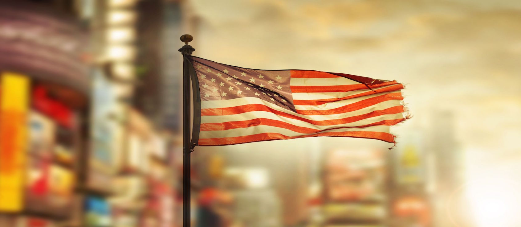 Tattered american flag blowing in the wind