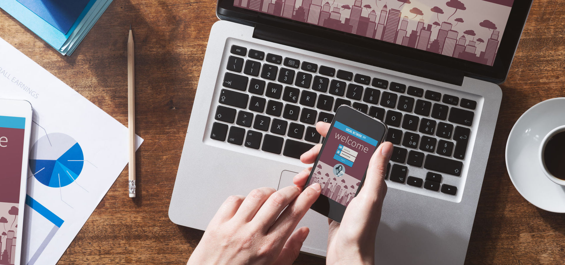 Social network user login on smartphone and website mock up on computer screen