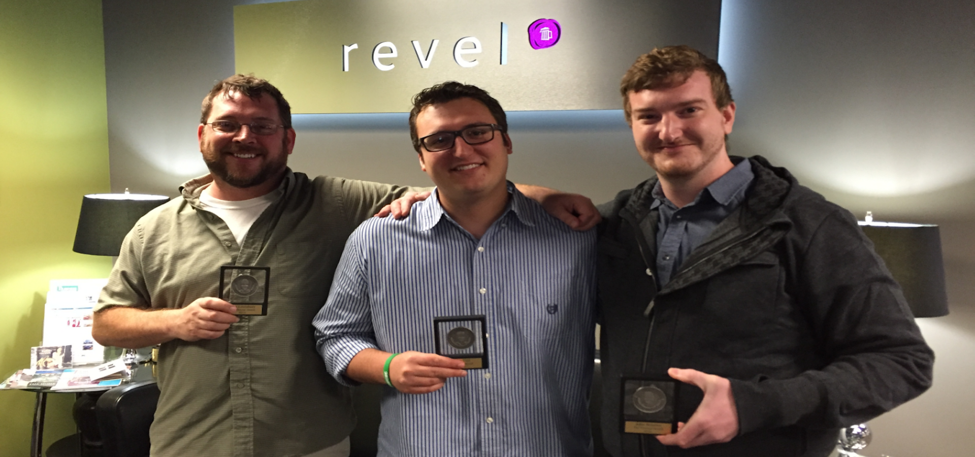 Pete, Drew and John holding up Revel Awards