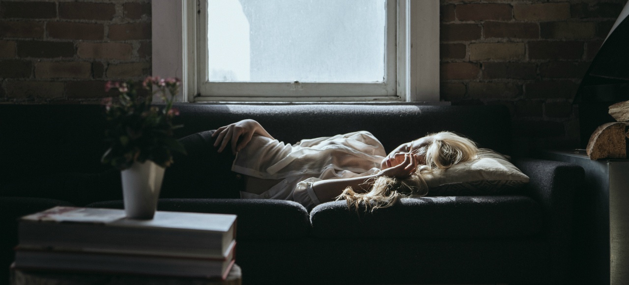 Woman asleep on couch