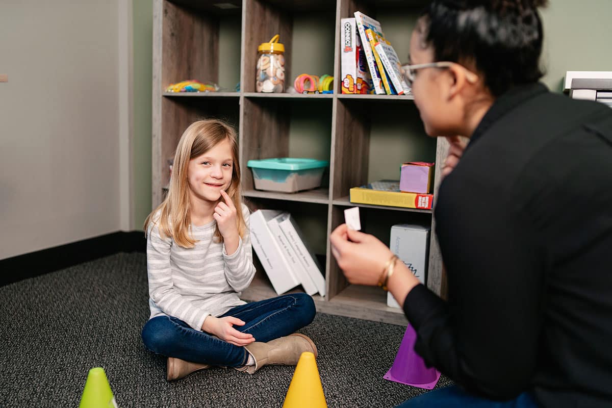 Young girl with ABA therapist